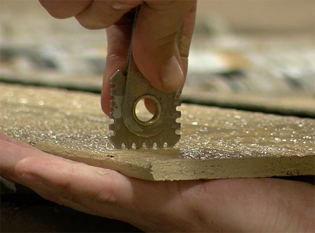 Quality control being performed on a piece of wood