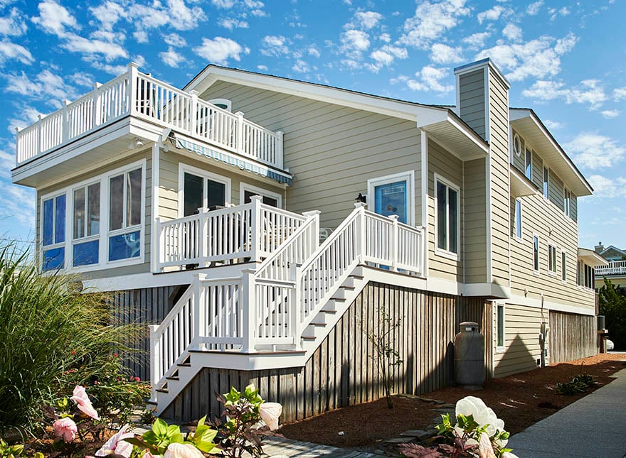 Tan beach front home with ColoRISE Rise siding stairs 